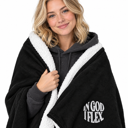 IGIF Sherpa Blanket in Black, wrapped around a model